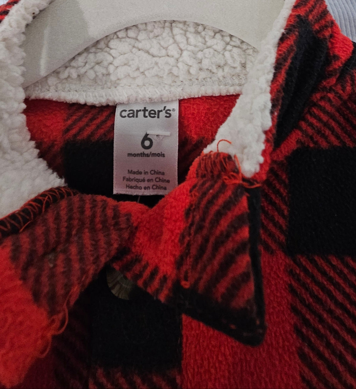 Carter's size 6 months label and cream lined collar