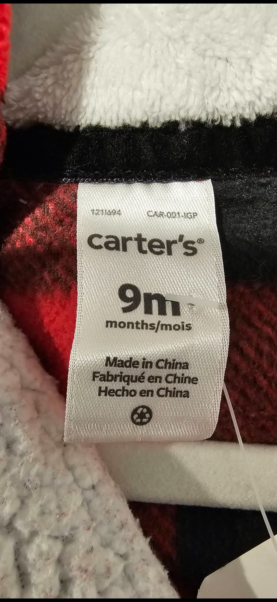 Carter’s size label showing 9 months