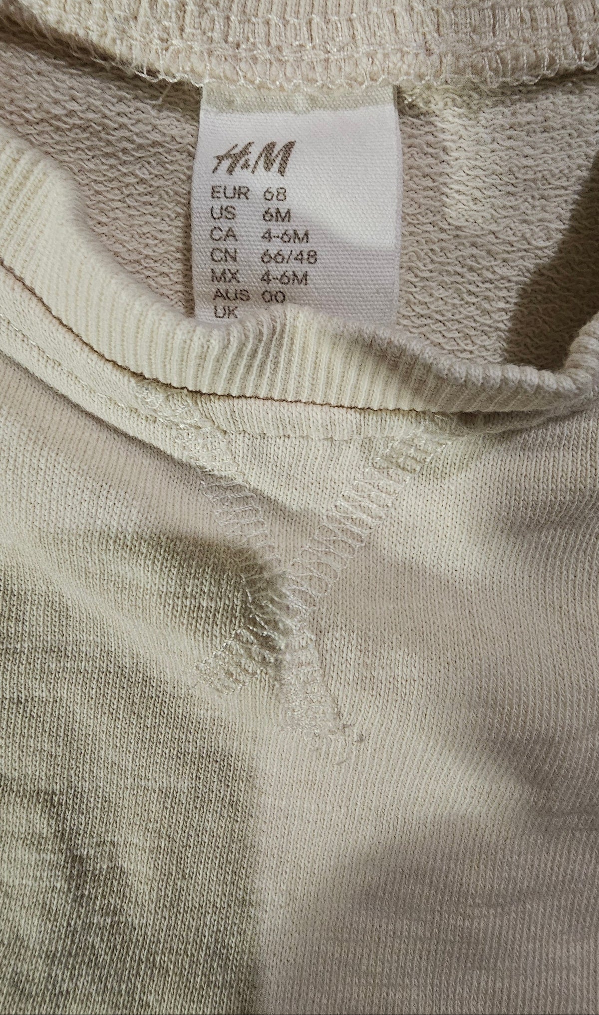 H&M size tag, EUR 68 / CA 4-6M
