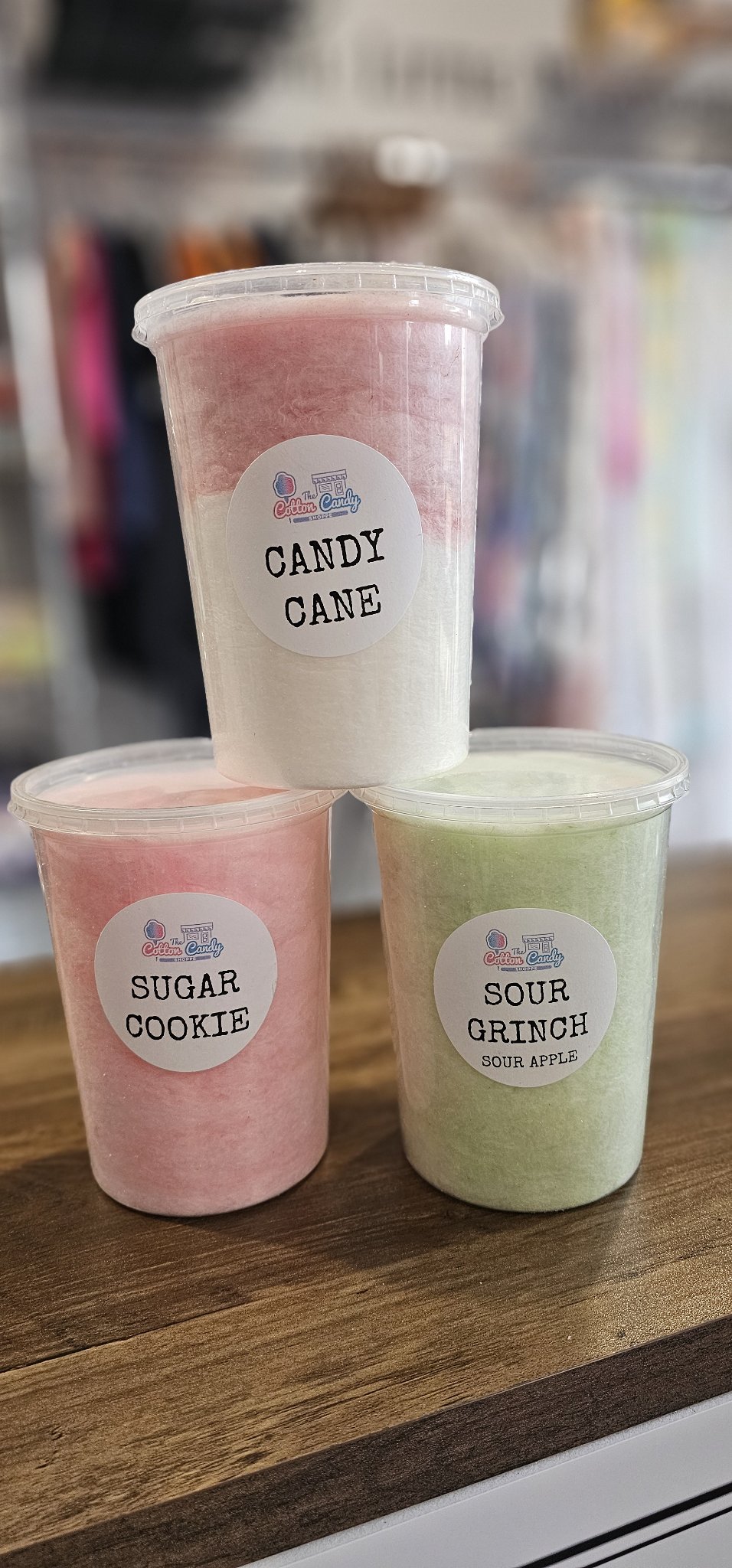 The Cotton Candy Shoppe cotton candy - Candy Cane, Sugar Cookie and Sour Grinch tubs