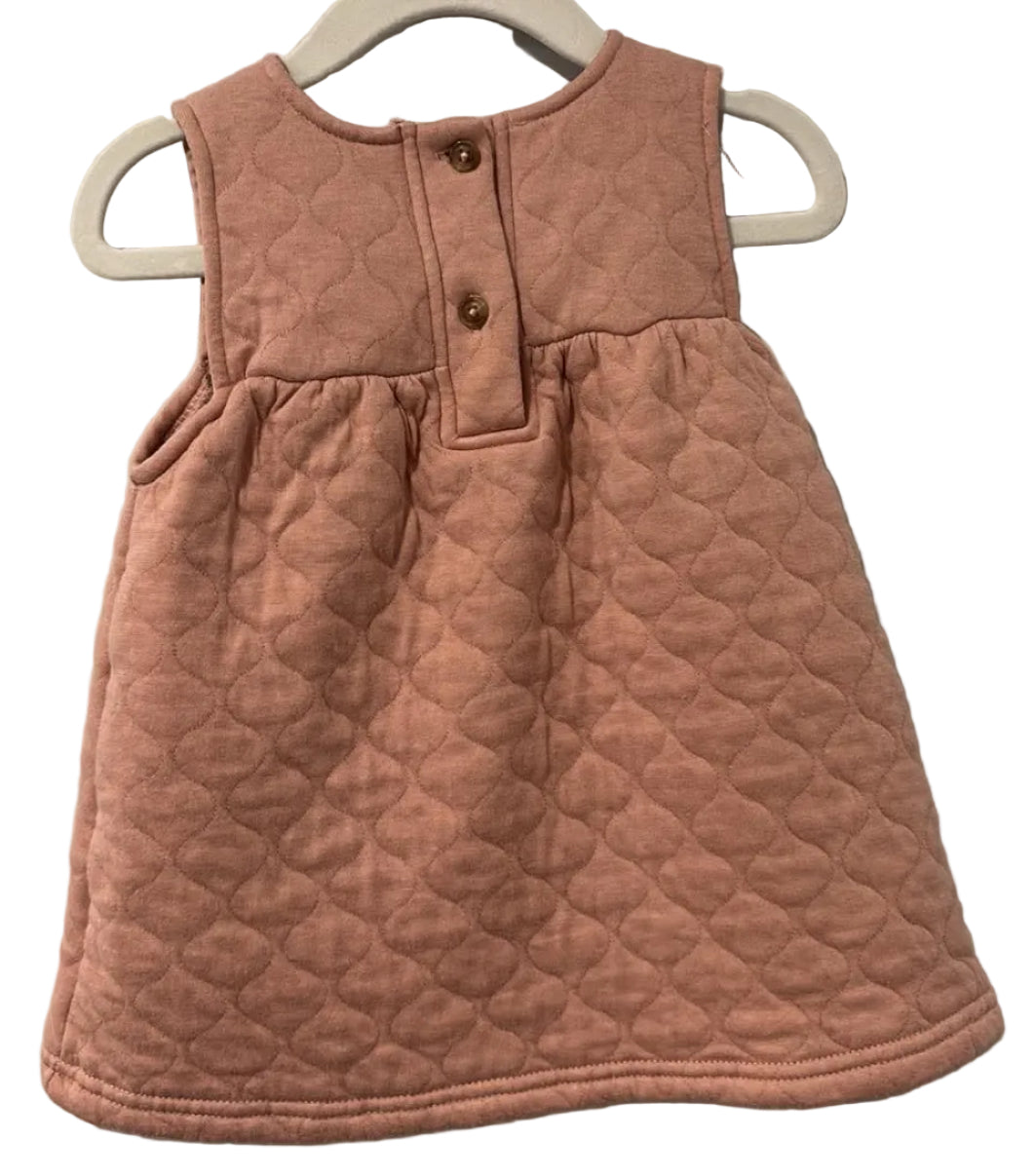 Back of Nicole Miller sleeveless dress showing button closure