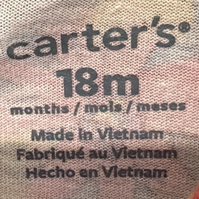 Carter’s dress label showing size 18 months
