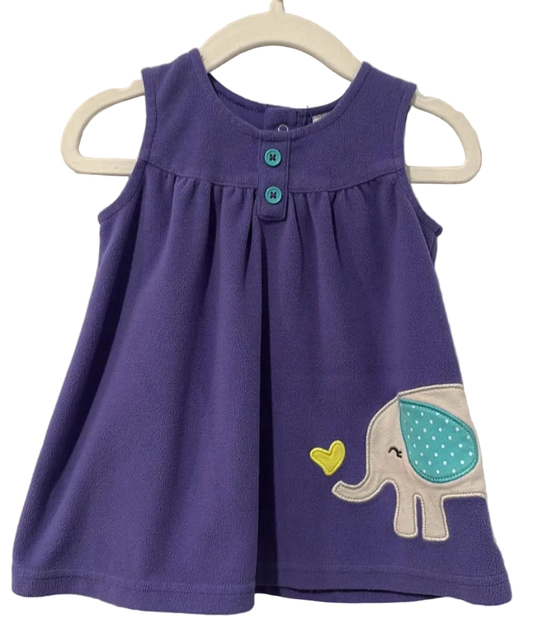 Carter’s label showing size 6 months and polyester fabric composition