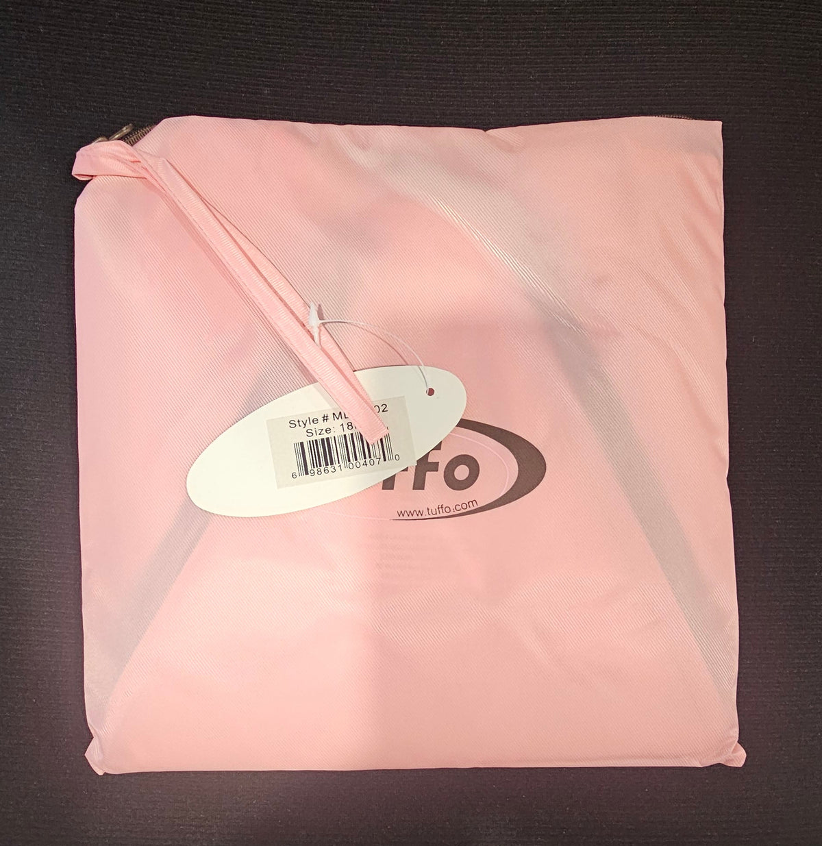 Pink Tuffo Muddy Buddy travel bag with attached tag