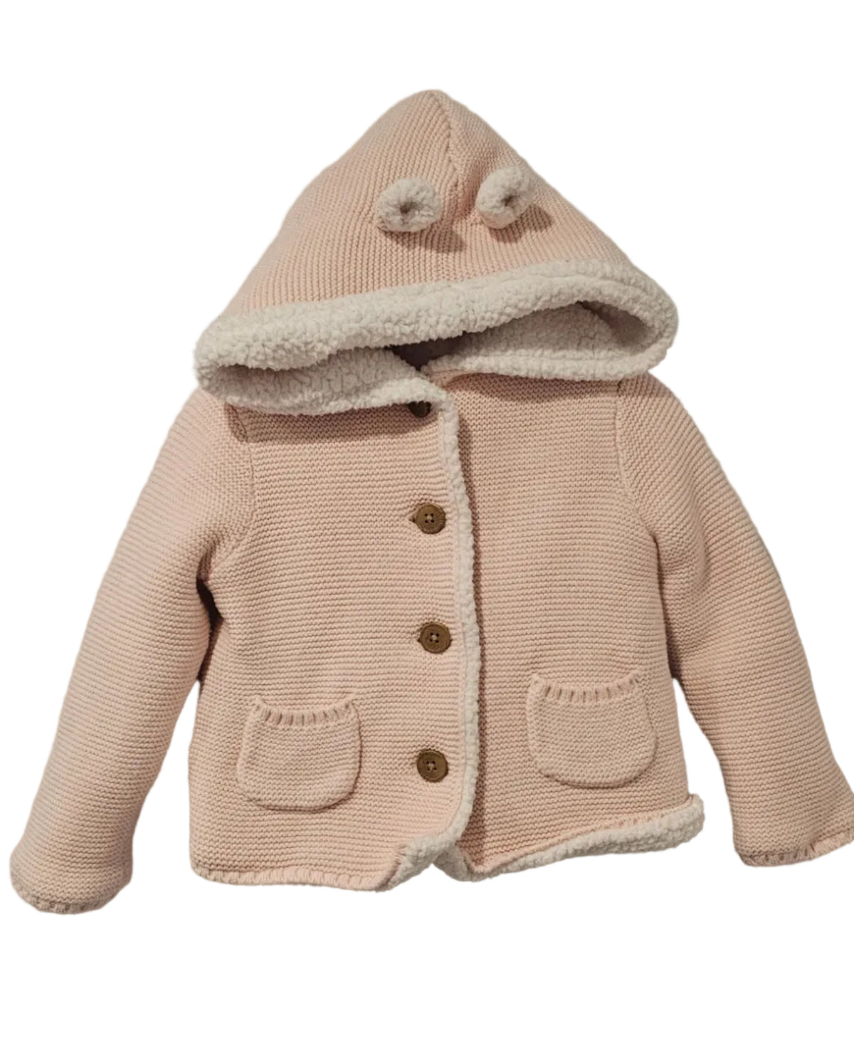 Pale pink Carter’s knit cardigan with a pom-pom hood, cream fluffy trim, brown buttons and two front pockets