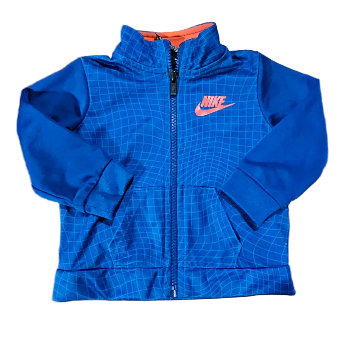 Blue Nike zip-up baby jacket with grid pattern and orange logo