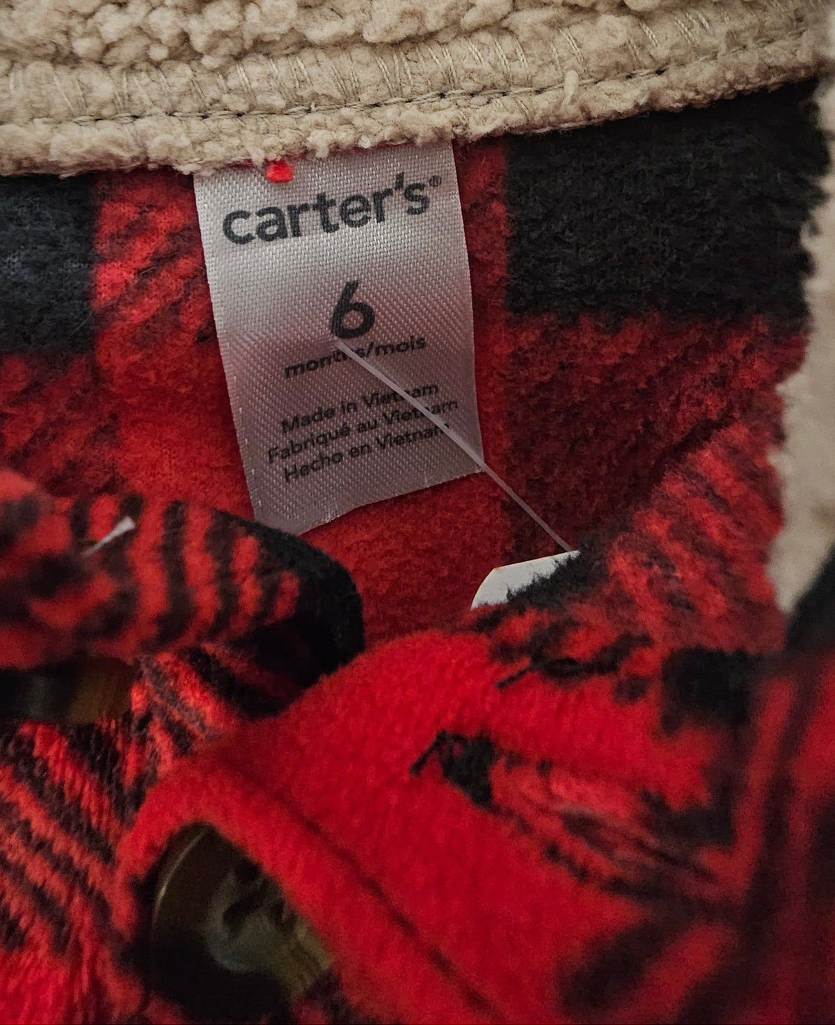 Carter's 6 month size label and cream lined collar