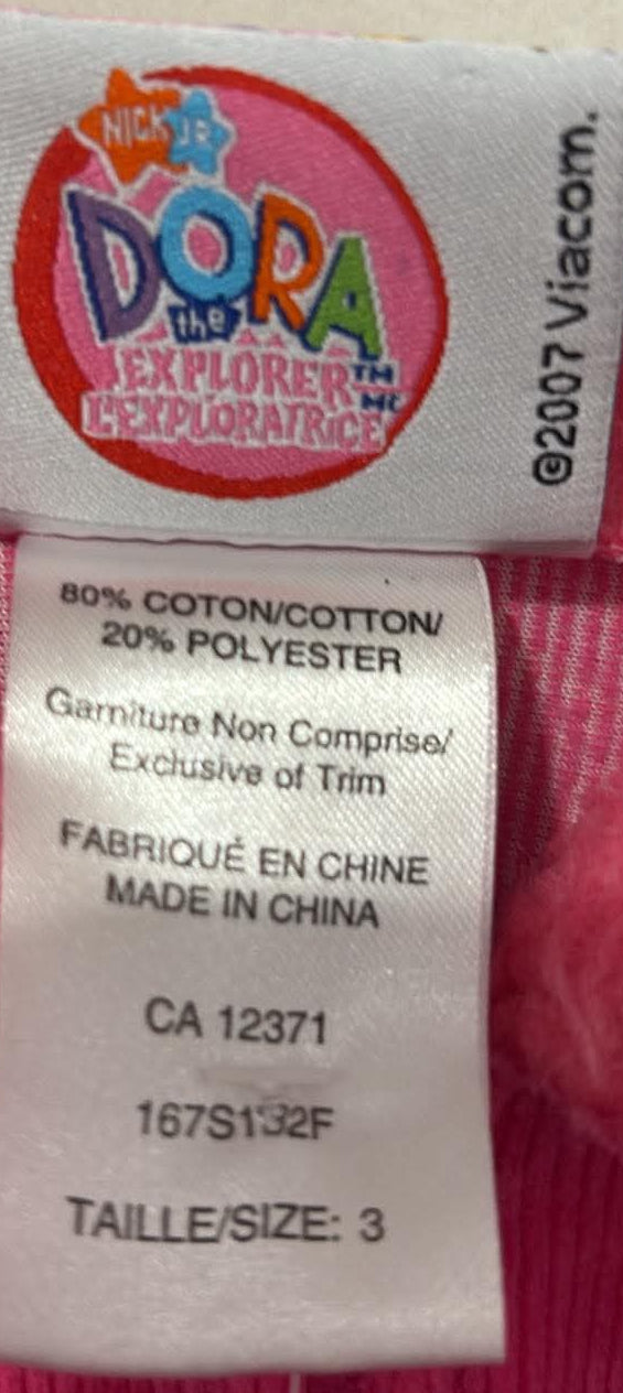 Dora the Explorer label showing size 3 and fabric composition