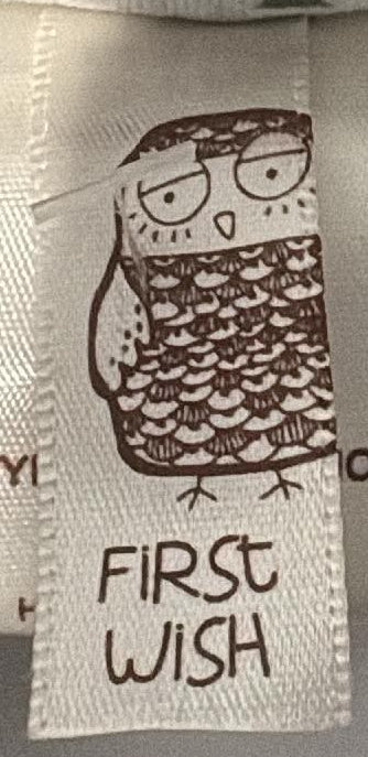 First Wish brand label and tree-print lining