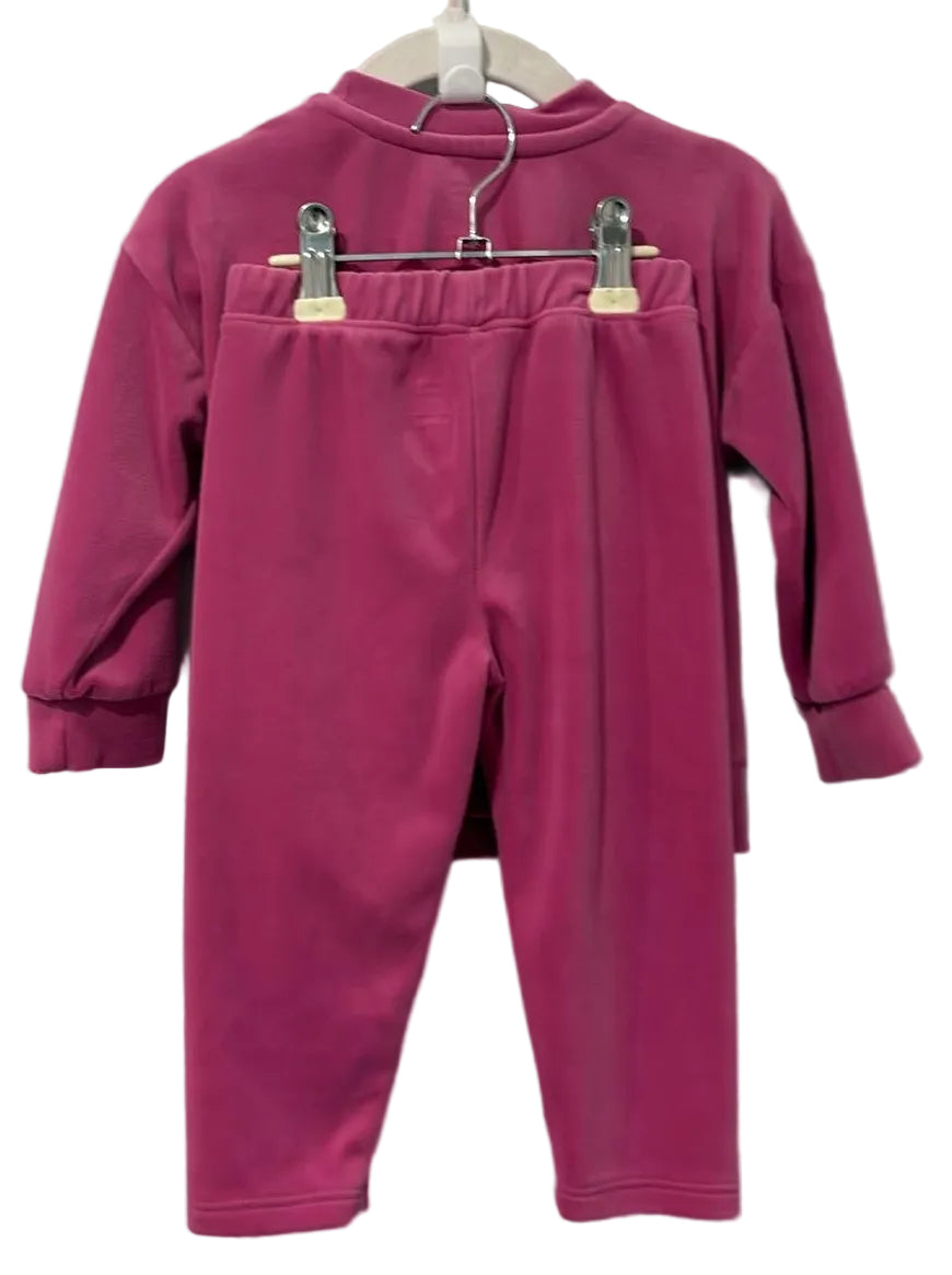 Back of George berry-pink two-piece outfit