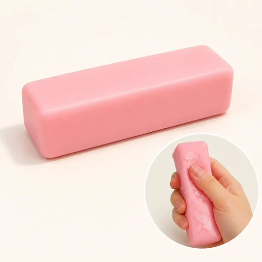 Pink rectangular butter-shaped squeeze toy with inset showing it squeezed by hand
